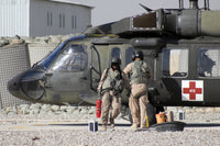 UH-60 Blackhawk Medivac helicopter refueling at Camp Warhorse poster print.