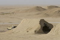 Al Asad, Iraq Armored Vehicle Poster Print depicting a bombed magazine.