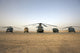U.S. Military vehicles and aircraft lined up on the taxiway at Camp Speicher, Iraq poster print.