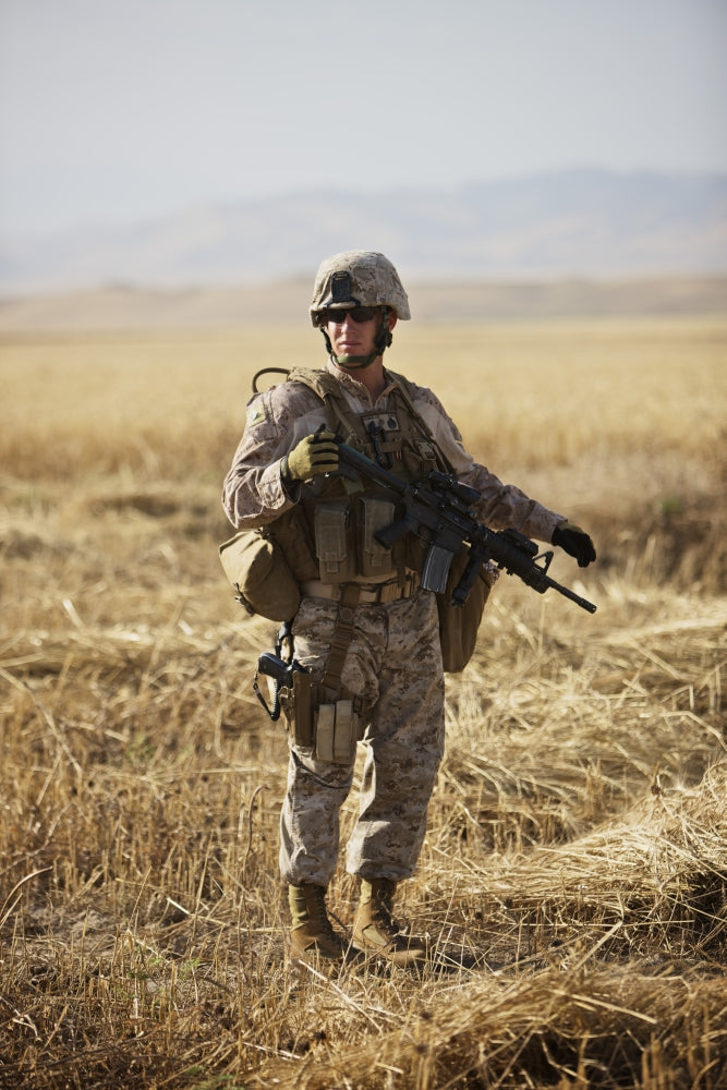 U.S. Marine patrols wadi near Konduz, Afghanistan poster print.
