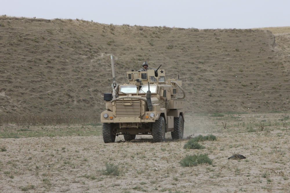 U.S. Army Cougar patrols a wadi in Kunduz Afghanistan poster print