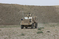 U.S. Army Cougar patrols a wadi in Kunduz Afghanistan poster print