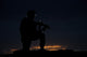 Partially silhouetted U.S. Marine on a bunker in Northern Afghanistan poster print.