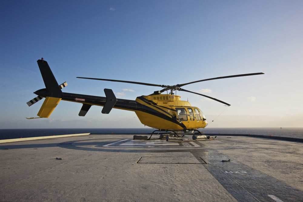 Bell 407 Utility Helicopter on Oil Rig Helipad Poster Print