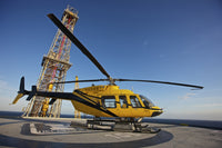 Bell 407 Utility Helicopter on Oil Rig Helipad Poster Print