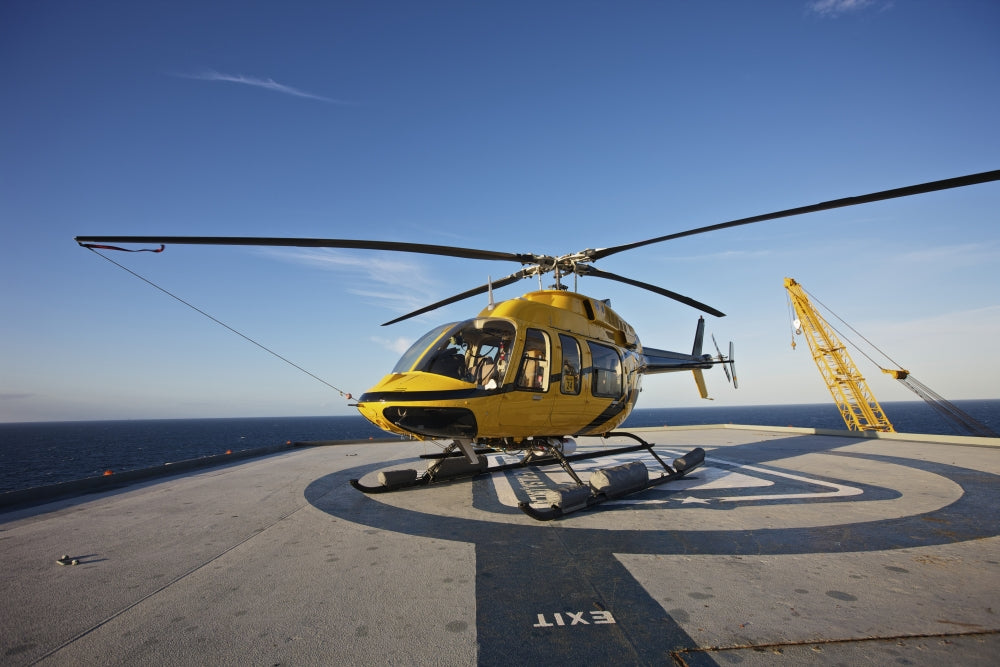 Bell 407 Utility Helicopter on Oil Rig Helipad Poster Print