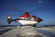 Eurocopter EC135 utility helicopter on oil rig helipad in Gulf of Mexico poster print