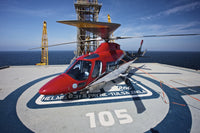 AgustaWestland AW109E Helicopter parked on oil rig helipad poster print
