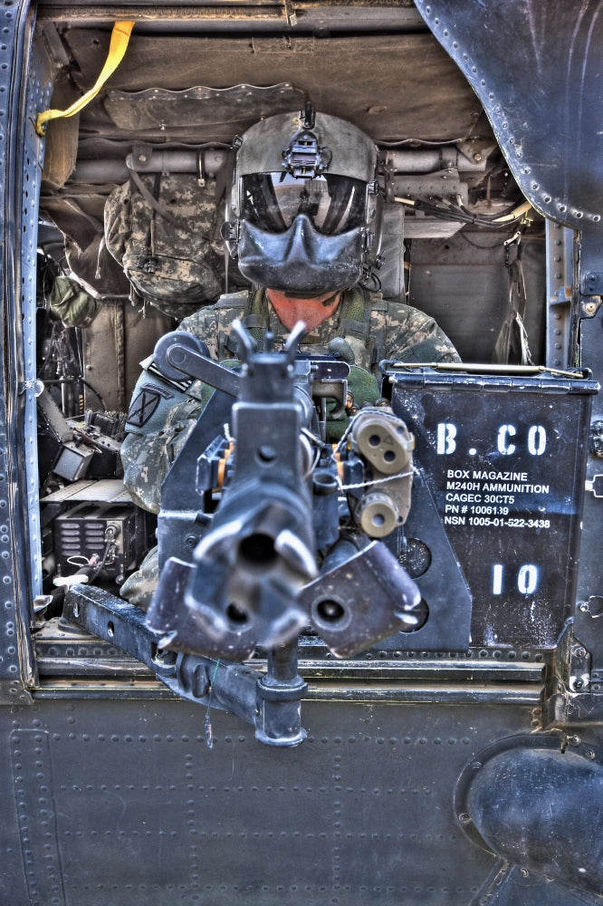 UH-60 Black Hawk door gunner poster print showcasing M240B machine gun in Tikrit, Iraq.