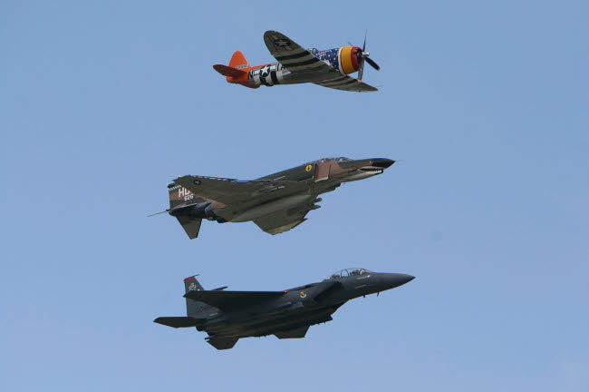 Heritage Flight Poster Print featuring F-15 Eagle, P-47 Thunderbolt, and F-4 Phantom