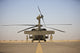 UH-60 Black Hawk flight crew members poster print featuring fire extinguishers during startup in Tikrit, Iraq.