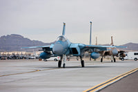 F-15C Eagles Taxiing Poster Print by Terry Moore showcasing military aviation.