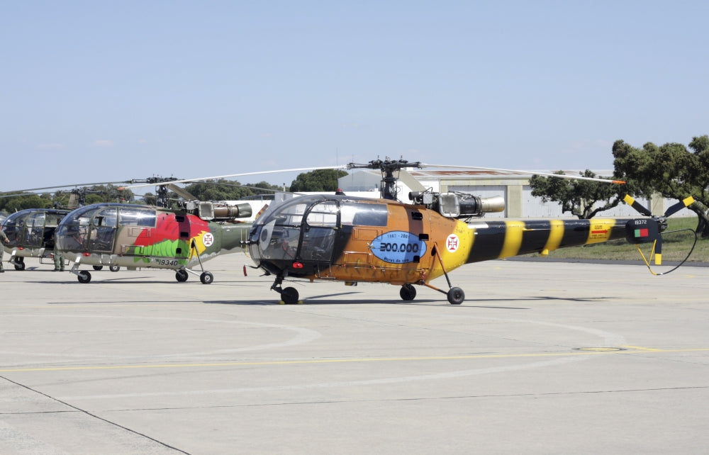 Alouette III utility helicopters of the Portuguese Air Force parked on the flight line at Beja, Portugal.