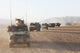 Convoy of Dutch Army vehicles in Afghanistan poster print showcasing military vehicles in action.