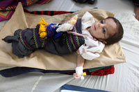Pediatric Ward of an Afghan Hospital Poster Print showcasing healthcare compassion.