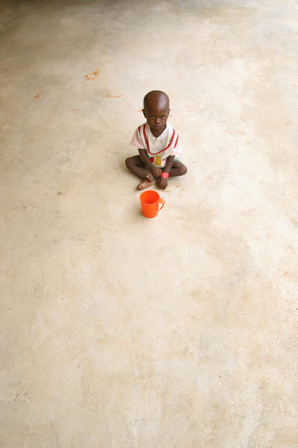 Poster print of a malnourished child in a clinic during the 2008 famine in Nigeria