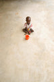 Poster print of a malnourished child in a clinic during the 2008 famine in Nigeria