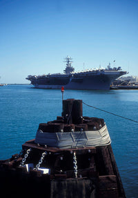 USS Abraham Lincoln docked at Pearl Harbor Naval Station poster print.