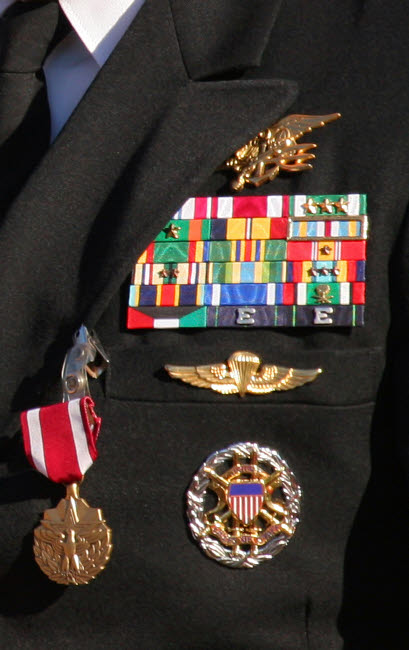 Close-up view of military decorations on a commander's dress uniform poster print.