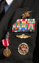 Close-up view of military decorations on a commander's dress uniform poster print.