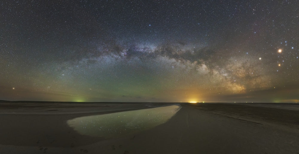 Milky Way arch over Lake Elton salt lake in Russia poster print.