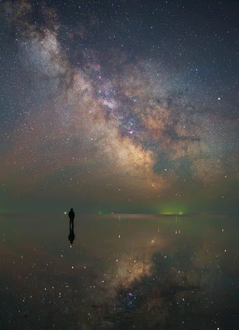 Poster print of a man standing alone on Lake Elton under the Milky Way.