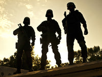 Silhouettes of S.W.A.T. officers holding guns poster print by Oleg Zabielin.