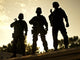 Silhouettes of S.W.A.T. officers holding guns poster print by Oleg Zabielin.