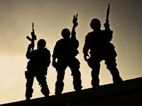 Silhouettes of S.W.A.T. officers holding guns poster print by Oleg Zabielin