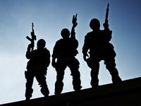 Silhouettes of S.W.A.T. officers holding guns poster print by Oleg Zabielin