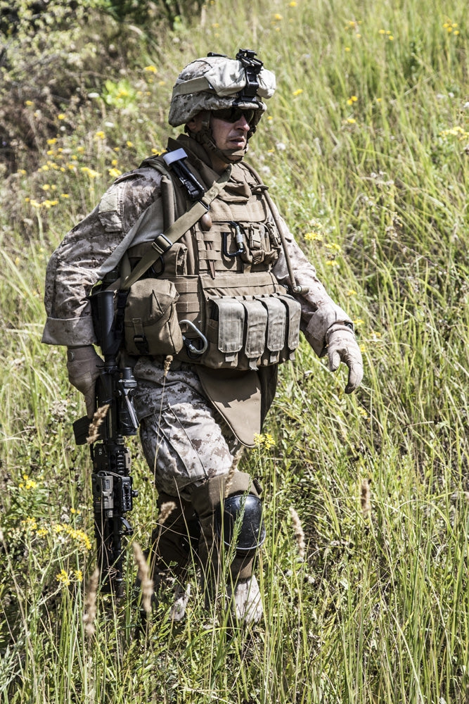 Close-up photo of a U.S. Marine with rifle by Oleg Zabielin