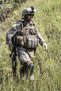 Close-up photo of a U.S. Marine with rifle by Oleg Zabielin