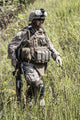 Close-up photo of a U.S. Marine with rifle by Oleg Zabielin