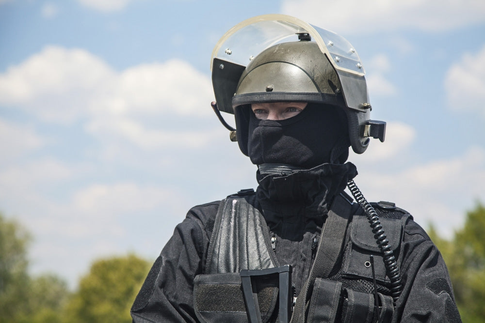 Spec Ops soldier in black uniform and face mask with rifle poster print by Oleg Zabielin.