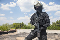 Spec Ops soldier in black uniform and face mask with rifle poster print.