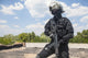 Spec Ops soldier in black uniform and face mask with rifle poster print.