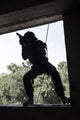 Spec Ops soldier in face mask during rope exercises with weapons - Poster Print