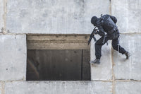 Spec Ops soldier in face mask during rope exercises with weapons poster print.
