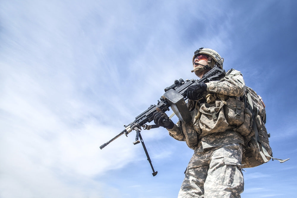Poster print of United States Airborne Infantry Corporal with machine gun.