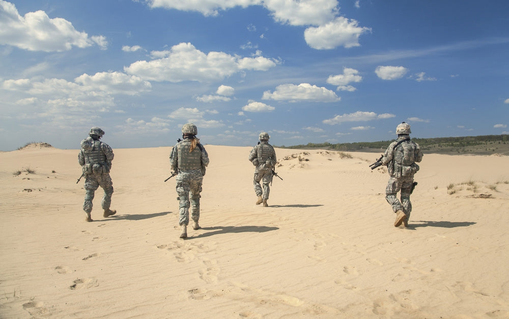 Team of United States Airborne Infantry Men Patrolling the Desert Poster Print
