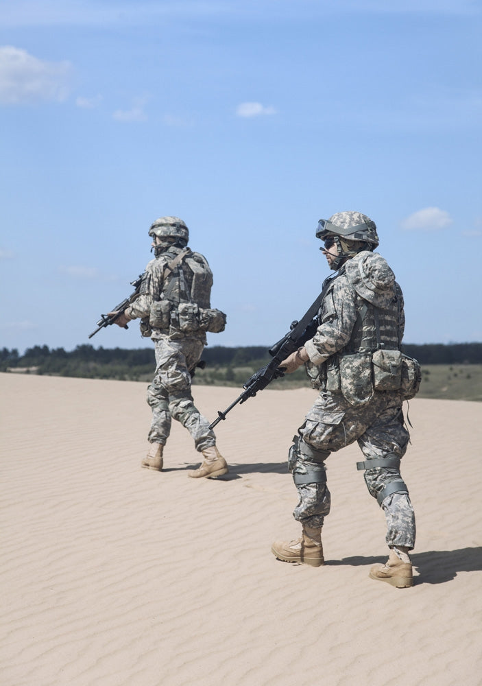 Poster print of United States airborne infantrymen patrolling the desert by Oleg Zabielin.