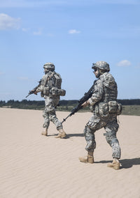 Poster print of United States airborne infantrymen patrolling the desert by Oleg Zabielin.
