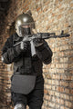 Special forces operator in black uniform and bulletproof vest poster print.