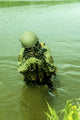 Austrian Jagdkommando soldier navigating water in a poster print.