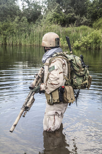 Navy SEAL Team member crossing the river with weapons poster print.