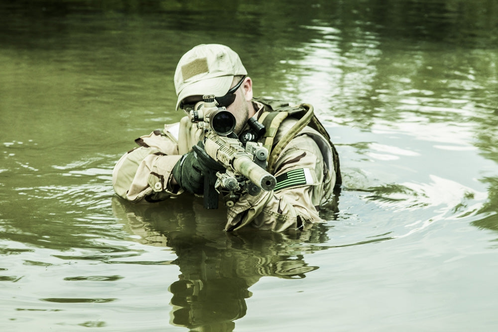 Navy SEAL Team crossing the river with weapons - Poster Print by Oleg Zabielin