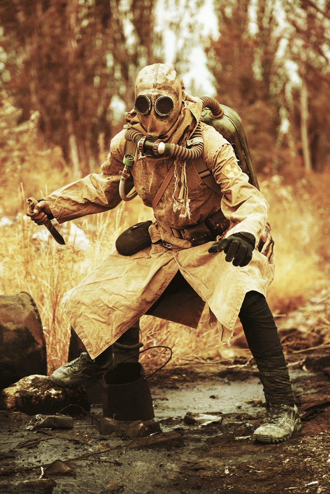 Post-apocalypse survivor in gas mask standing on urban ruins art print by Oleg Zabielin.