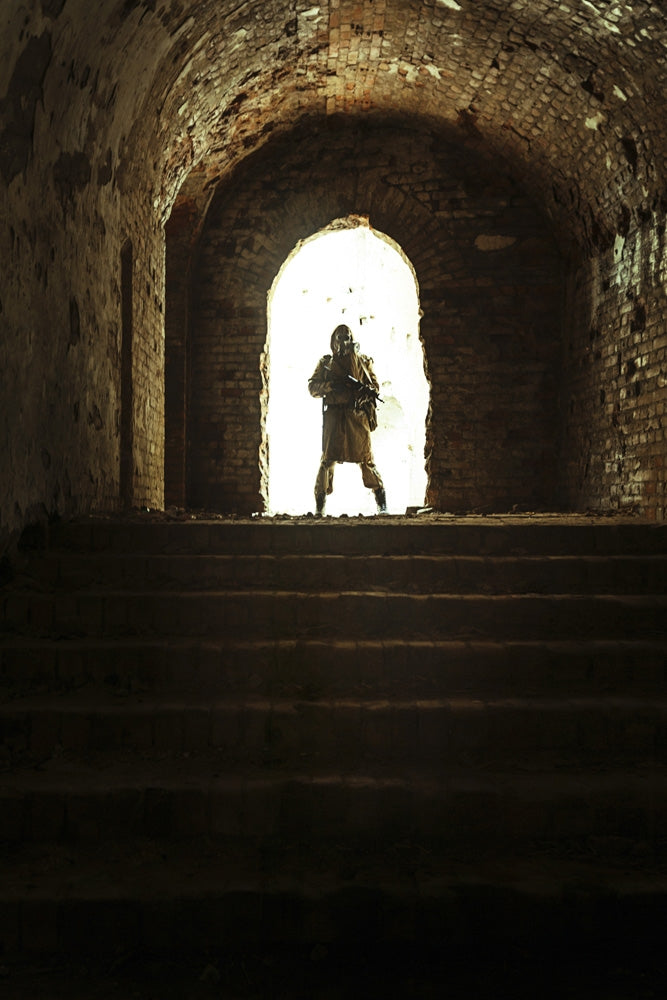 Post-apocalypse survivor in gas mask on city ruins poster print.
