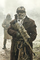 Nuclear post-apocalypse survivors in a destroyed city poster print by Oleg Zabielin.