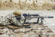 Young male sniper in camouflage with gun in the desert poster print.
